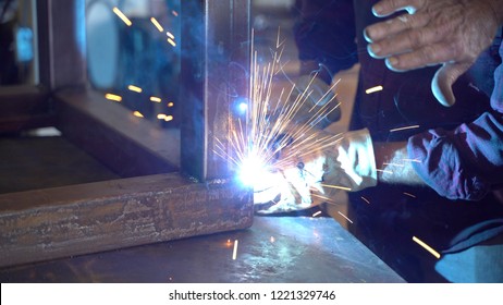 Person Welding A Metal Table Legs