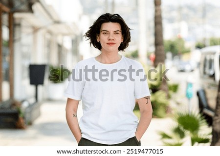 Person in white tee, basic wear apparel fashion, young people wearing white plain T shirt on the street, white man black hair wearing basic white T shirt, outdoor lifestyle with t shirt