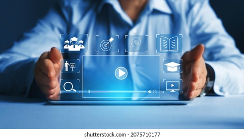 Person who attends online lessons on a virtual screen tablet. E-learning education, internet lessons and online webinar. Education internet Technology.
 - Shutterstock ID 2075710177