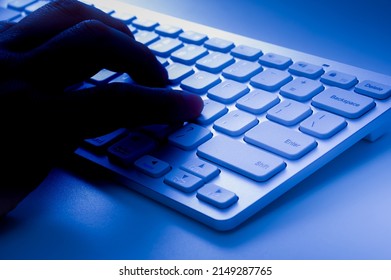 A Person Who Operates A Computer In The Dark