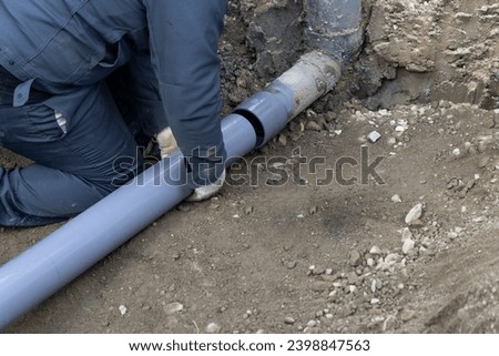 A person who performs plumbing work to connect residential drainage to the sewer system