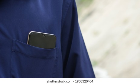 A Person Who Puts His Cell Phone In His Front Pocket.