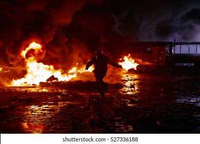 The Person Who Runs In The Fire. Protester To Escape From Danger