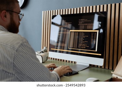 Person working at desk with computer screen displaying and reflecting code, Hackathon setup with various code snippets and settings visible on monitor
