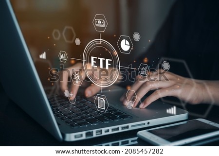 Person working on computer to ETF Exchange traded fund stock market trading investment financial concept.
