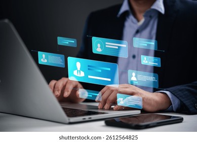 person working on a laptop with digital profile icons, focusing on online communication and cybersecurity. virtual networking, digital identity, and personal data security.