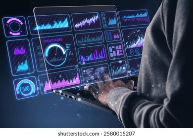 Person working on a laptop with glowing digital charts, graphs, and analytics on a dark background. Concept of modern financial technology