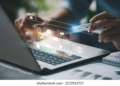 Person working with tcomputer laptop for manage search engine optimization : SEO with social media content and advertisement from website. - Shutterstock ID 2172915717