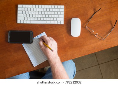 Person Writing In Check Ledger Register Online Banking Desk Keyboard Mouse 