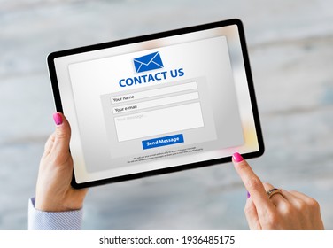 Person Writing Inquiry On Contact Form Online