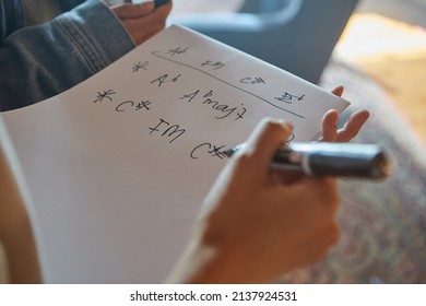  A Person Writing Music Chords On A Paper Close Up Shot