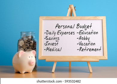  Personal Budget, Financial Concept. Mason Jar With Coins Inside, Piggy Bank And Whiteboard On Wooden Table.