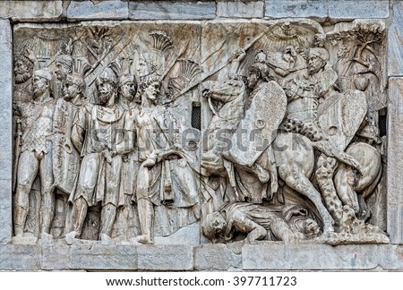 Personal cavalry of the emperor commanded by Trajan and conquering barbarians, the frieze of arch of Constantine in Rome
