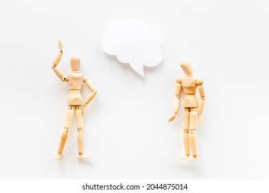 Personal communication concept. Two wooden mannequin figures connection - Powered by Shutterstock