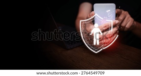 Personal data breach and cybersecurity concept. Broken shield protecting human figure is attacked, held by a man using smartphone. Identity theft protection, web scam, information leak, or mobile hack