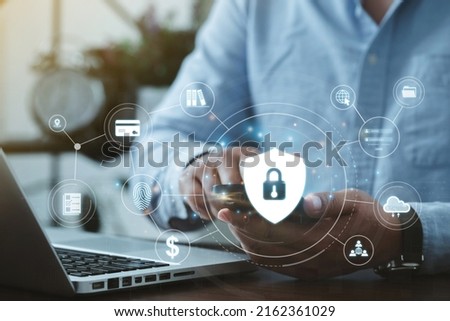 Personal Data Protection Act or PDPA concept. A young man uses a phone with a fingerprint scan concept. Shield with a lock icon on the screen of futuristic protection from data theft. privacy.vpn