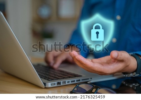 Personal Data Protection Act or PDPA concept. Businessmen use a phone with fingerprint scanning concept. Shield with lock icon on screen, futuristic protection from privacy theft.