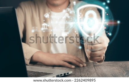 Personal Data Protection Act or PDPA concept.man uses a laptop with a biometric identification fingerprint scan concept.surveillance and security scanning of digital programs cyber futuristic.privacy.