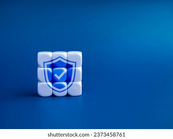 Personal data protection and cyber security network system of internet, technology concepts. Digital safety shield, secure padlock icon shape on completed assembly cube blocks on blue with copy space.