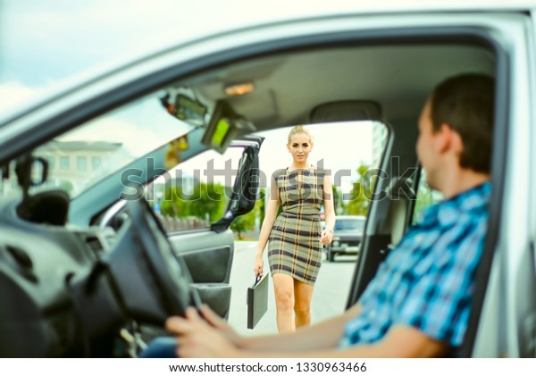 personal driver. A\
pretty business woman getting into a taxi cab . Skinner wait\
businesswoman inside luxury car. Young adult girl walk outdoor to\
auto. Empty space for\
inscription