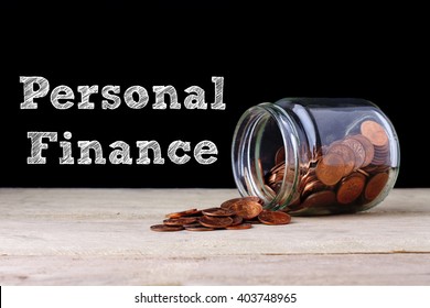 Personal Finance Concept - Coin Out Of Jar..