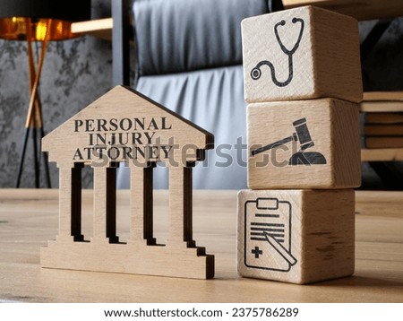 Personal injury attorney sign and cubes as a concept of law.