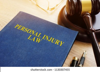 Personal Injury Law On A Desk And Gavel.