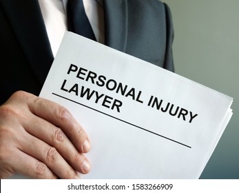 Personal Injury Lawyer With Clipboard And Law.