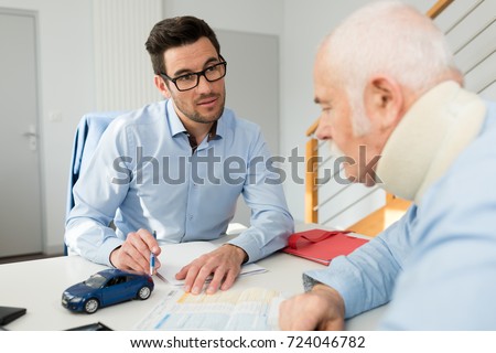 personal injury lawyer in meeting with client wearing neck brace