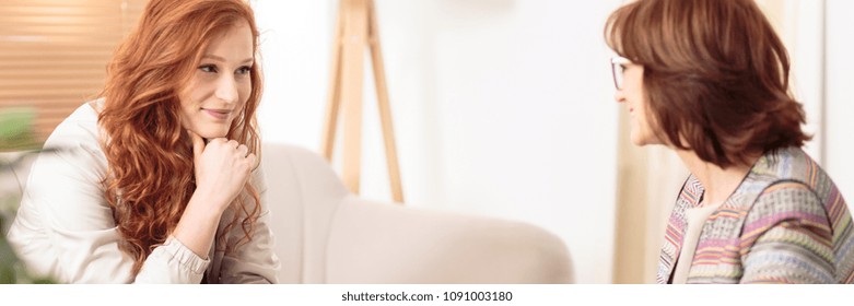 Personal life coach talking to her client during a session - Powered by Shutterstock