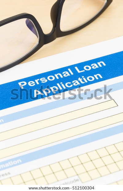 Personal loan\
application form with\
glasses