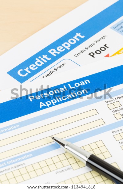 Personal\
loan application form poor credit score with\
pen