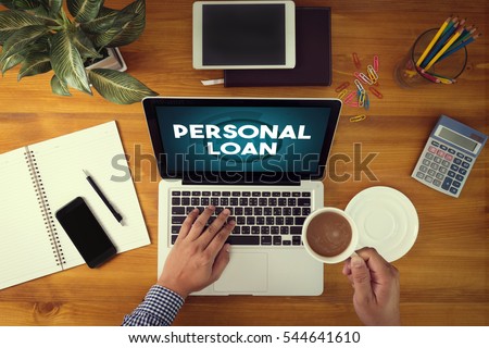 PERSONAL LOAN Businessman working at office desk and using computer and objects, coffee, top view,