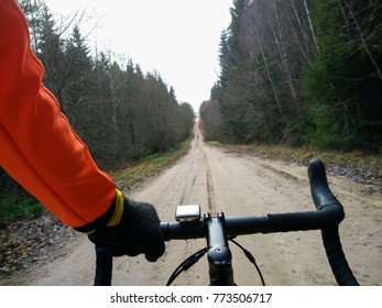 Personal Perspective Of A Cyclist Riding A Road Bicycle On The Amazing Road. POV. A Bicycle On Gravel Road. Traveling On A Bicycle, View From The Eyes. Point Of View.