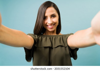 Personal Perspective Of An Hispanic Woman Taking A Selfie With A Camera Or Smartphone 