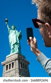 Personal Pov Perspective Of Tourist Taking Picture Of The Statue Of Liberty With His Smartphone