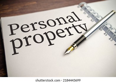 Personal Property Words On White Notepad And Pen