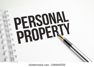 Personal Property Words On White Notepad And Pen