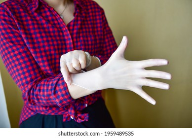 Personal Protective Equipment Vinyl Disposable Gloves, Woman Puts Her Hands In Gloves