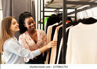 Personal Shopper. Fashion Stylist Helping Her Client Buy New Clothes Shopping In Trendy Clothing Store. Copy Space