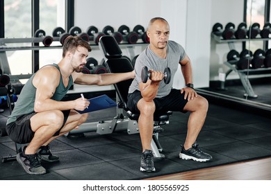 Man Training Dumbbell While Woman Holding Stock Photo (Edit Now) 647651584