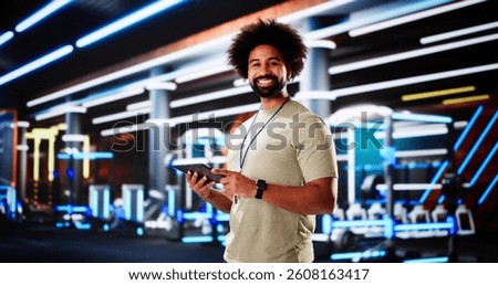 Personal Trainer Evaluating Workout Session with Fitness Club Client