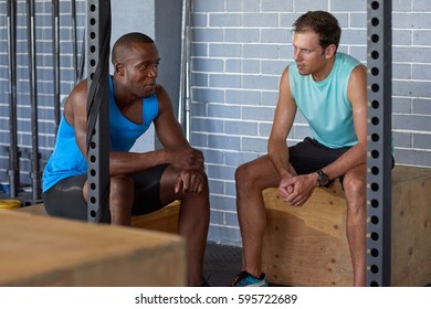 Personal Trainer Instructor  Discussing Training Plan Program With Client Before Exercise Routine