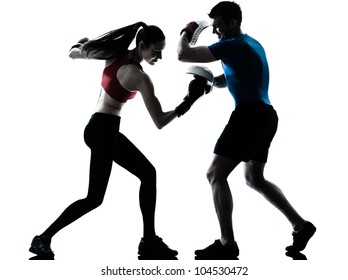 personal trainer man coach and woman exercising boxing silhouette  studio isolated on white background - Powered by Shutterstock