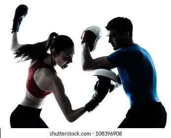 personal trainer man coach and woman exercising boxing silhouette  studio isolated on white background - Powered by Shutterstock