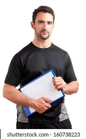 Personal Trainer, With A Pad In His Hand, Isolated In White