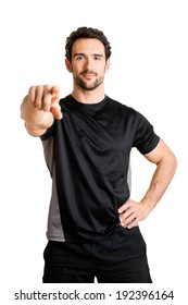 Personal Trainer Pointing At Viewer, Isolated In White