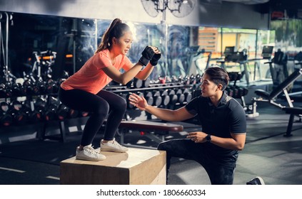 Personal Trainer To Practice Exercise With A Jump On The Box