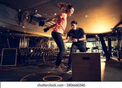 Personal Trainer To Practice Exercise With A Jump On The Box