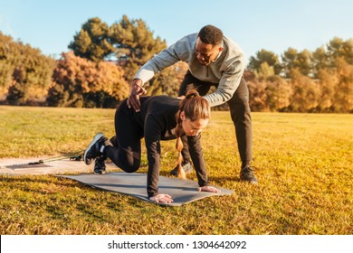 Personal Trainer Training A Girl On The Outside